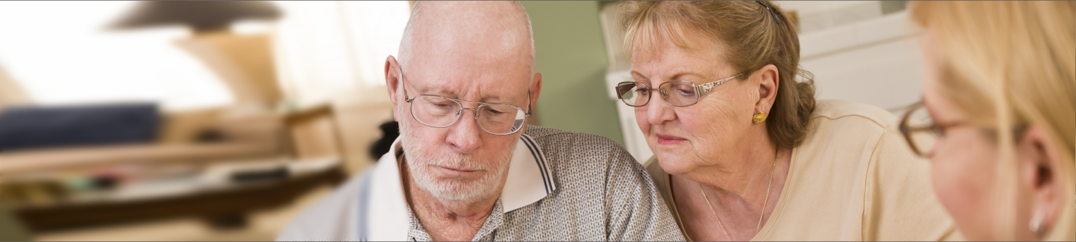 An Elderly Couple Looking Over Estate Planing Documents