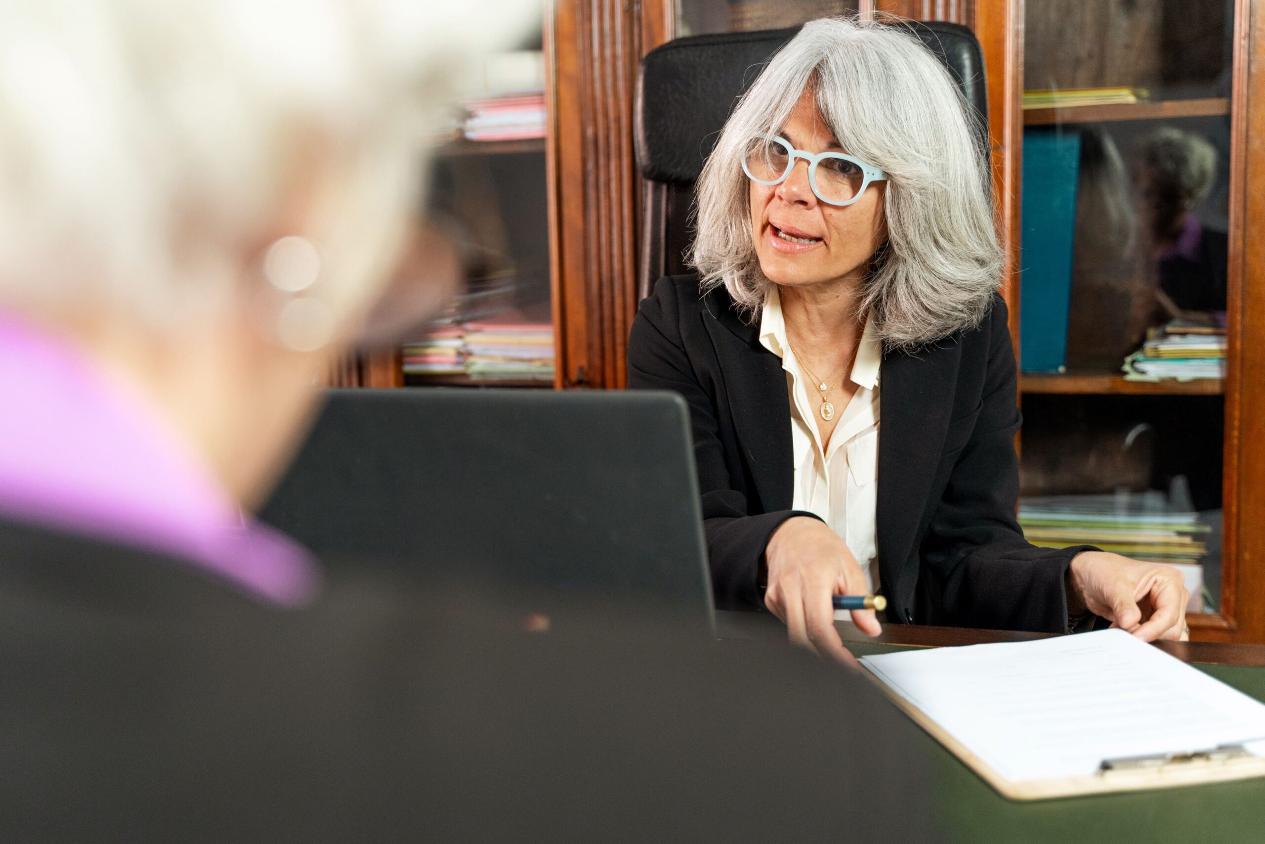 20424-experienced-female-elder-law-attorney-consults-with-senior-woman-adobestock_765550418_resized